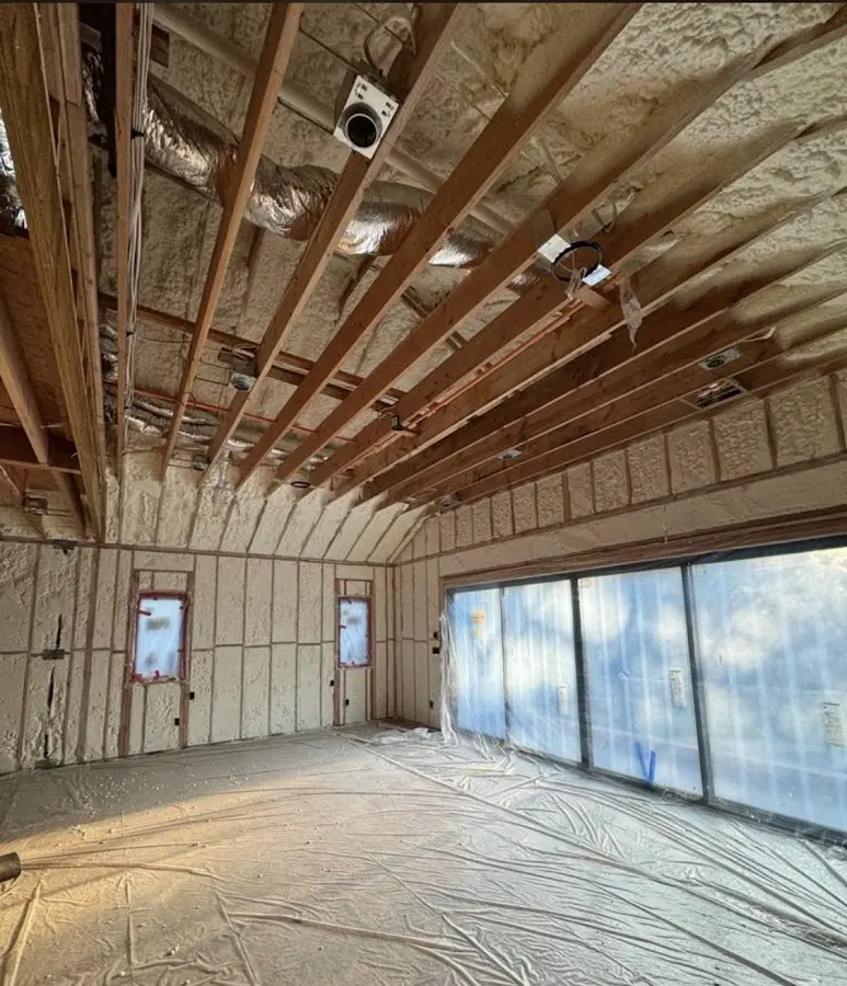 Interior walls and ceiling insulated with spray foam during new construction in Holden